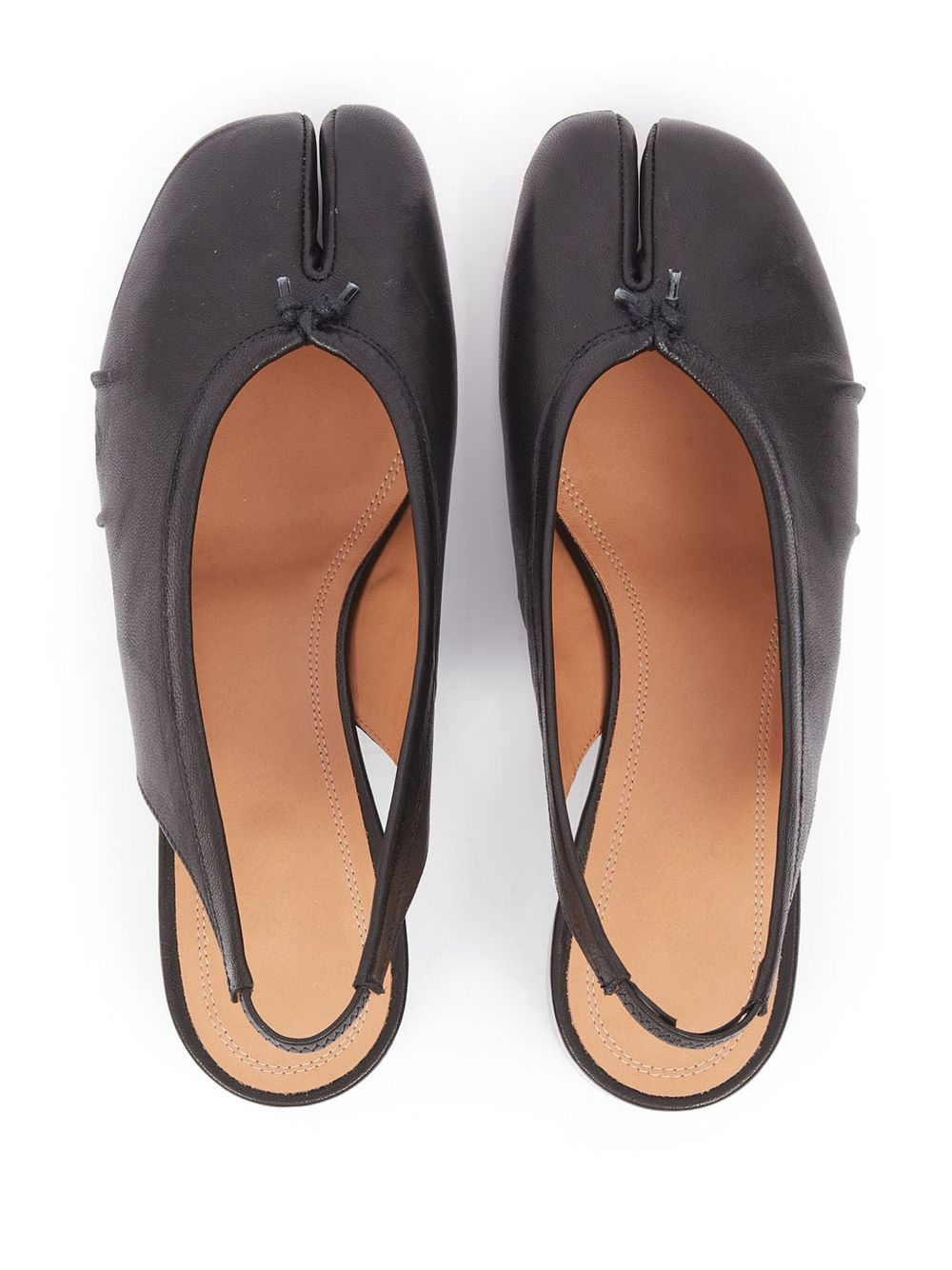 Pair of black open-toe shoes on a white background