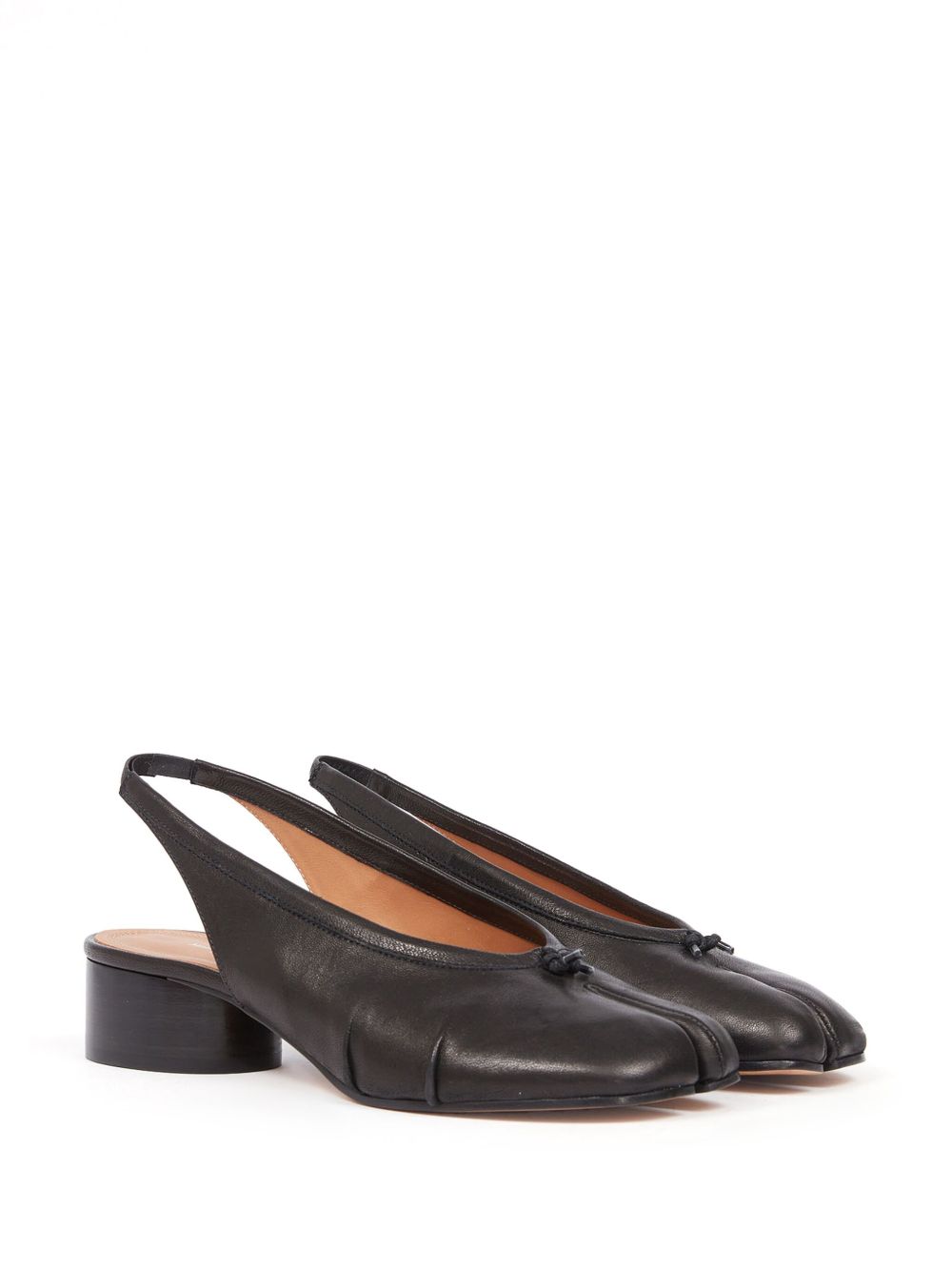 Pair of black leather slingback shoes on a white background