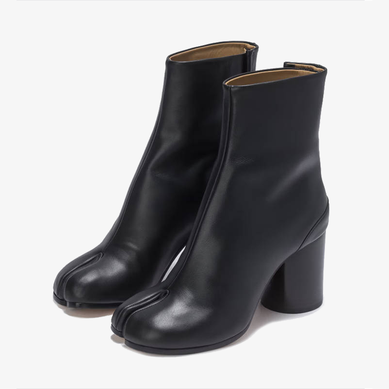 Pair of black tabi boots on a white background