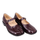 Pair of maroon shoes on a white background
